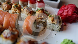 The video an assortment of Japanese sushi rolls, showcasing the exquisite combination of fresh fish and rice.