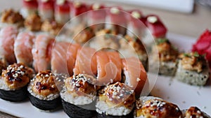 The video an assortment of Japanese sushi rolls, showcasing the exquisite combination of fresh fish and rice.