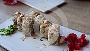 The video an assortment of Japanese sushi rolls, showcasing the exquisite combination of fresh fish and rice. The vibrant and