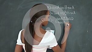 Video of a black student writing on a blackboard