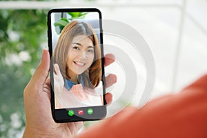 Video call conference, Happy girl having a video chat on mobile phone at home, Asian woman talking video call on a smartphone,
