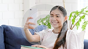 Video call conference, Happy girl having a video chat on mobile phone at home, Asian woman talking video call on a smartphone,