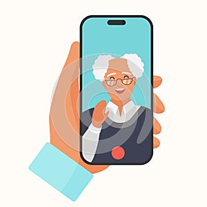Video call to senior man, hand holding phone to talk to elderly person on screen