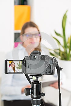 Video camera blog recording. Vlog blogger woman.