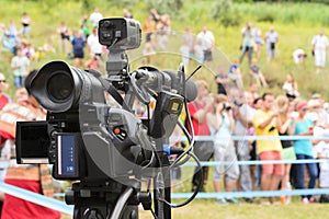 Video camera on the blurred background photo