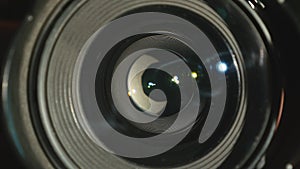 Video camera lens, showing zoom and glare, turns, close up