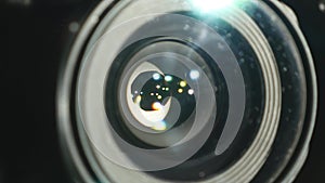 Video camera lens, showing zoom and glare, turns, close up