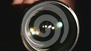 Video camera lens, showing zoom and glare, turns, close up