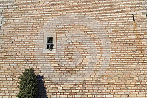 Video camera on an old brick fence