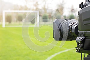 Video camera put on the back of football goal for broadcast on TV sport channel. football program can `t editing in studio