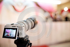 Video camera recording the great moment in wedding ceremony.