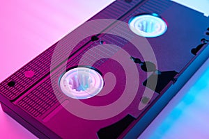 Video cassete on the color background. Retro vhs cassette tape