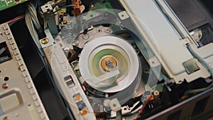 video cassette is loaded in the VCR, Magnetic videotape in the VCR mechanism.