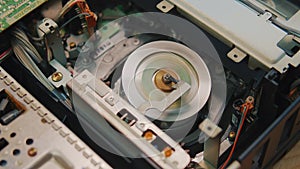 video cassette is loaded in the VCR, Magnetic videotape in the VCR mechanism.