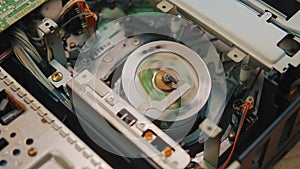 video cassette is loaded in the VCR, Magnetic videotape in the VCR mechanism.