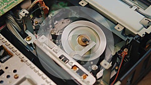 video cassette is loaded in the VCR, Magnetic videotape in the VCR mechanism.