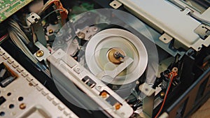 video cassette is loaded in the VCR, Magnetic videotape in the VCR mechanism.