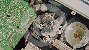 video cassette is loaded in the VCR, Magnetic videotape in the VCR mechanism.