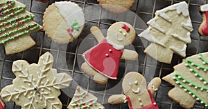 Video of christma cookies decorated sugar icing with copy space on grey background