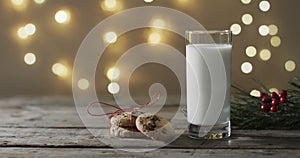 Video of christma cookies, glass of milk and copy space on woodenbackground