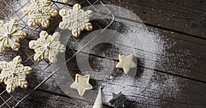 Video of christma star cookies decorated sugar with copy space on wooden background