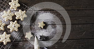 Video of christma star cookies decorated sugar with copy space on wooden background