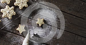 Video of christma star cookies decorated sugar with copy space on wooden background