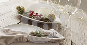 Video of christmas place setting with cutlery and candles on grey background