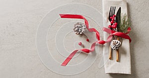 Video of christmas place setting with cutlery and copy space on grey background