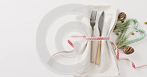 Video of christmas place setting with cutlery and copy space on white background
