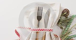 Video of christmas place setting with cutlery and copy space on white background