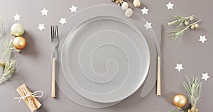 Video of christmas place setting with cutlery on grey background