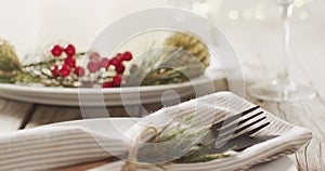 Video of christmas place setting with cutlery on grey background