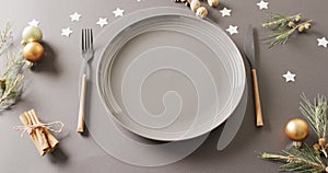 Video of christmas place setting with cutlery on grey background