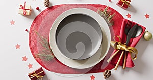 Video of christmas place setting with cutlery on white background