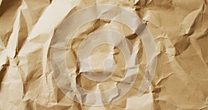 Video of close up of crumpled brown paper texture background