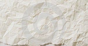 Video of close up of crumpled white paper texture background