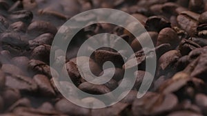 Video of coffee beans background in smoke with camera sliding back