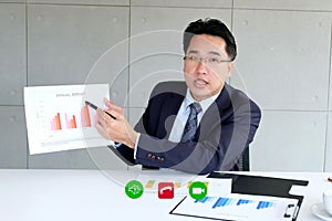 Video conference, Work from home, Asian man making video call to business team with virtual web, Contacting asia colleagues group