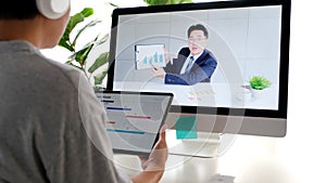 Video conference, Work from home, Asian man making video call to business team with virtual web while holding digital tablet,