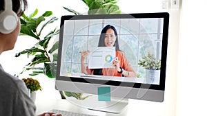Video conference, Work from home, Asian woman holding business chart while making video call to business team with virtual web,