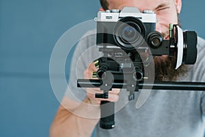 Video content creation man camera shooting footage
