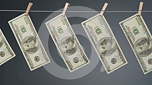 Video dollars drying on clothesline rope