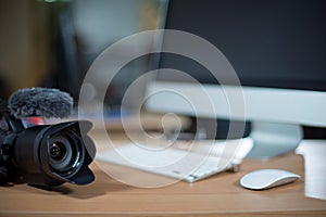 Video editing workstation with video camera beside