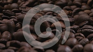 Video of falling coffee beans background with camera sliding forward