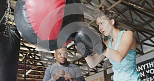 Video of fit diverse woman and man boxing at gym