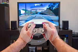 Video game console controller in man hands