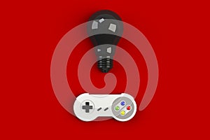 Video game console GamePad. Gaming concept. Top view retro joystick with light bulb isolated on red background