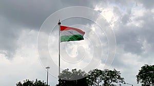 Video of a huge Indian national flag flying in slow motion against sky background