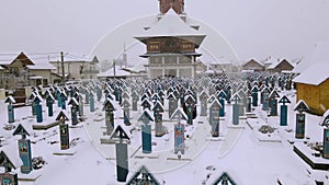 Video of the Jolly Cemetery in Sapanta, Romania in winter son while snowing.